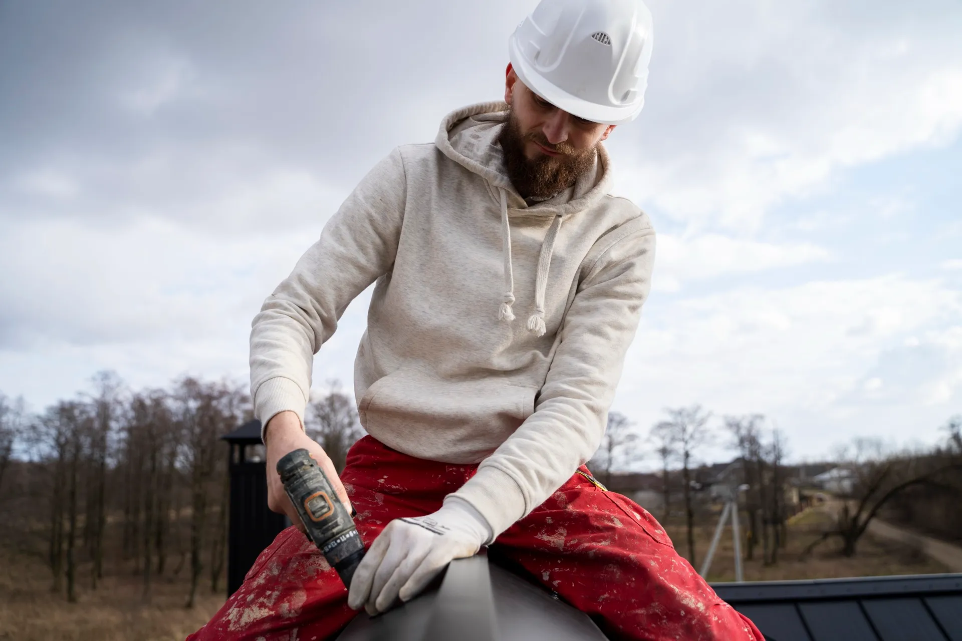 Roofer inspecting a residential roof